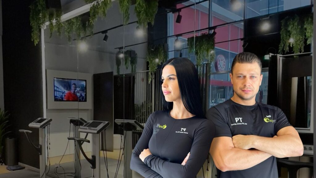 Two Easy Fit personal trainers inside an EMS studio