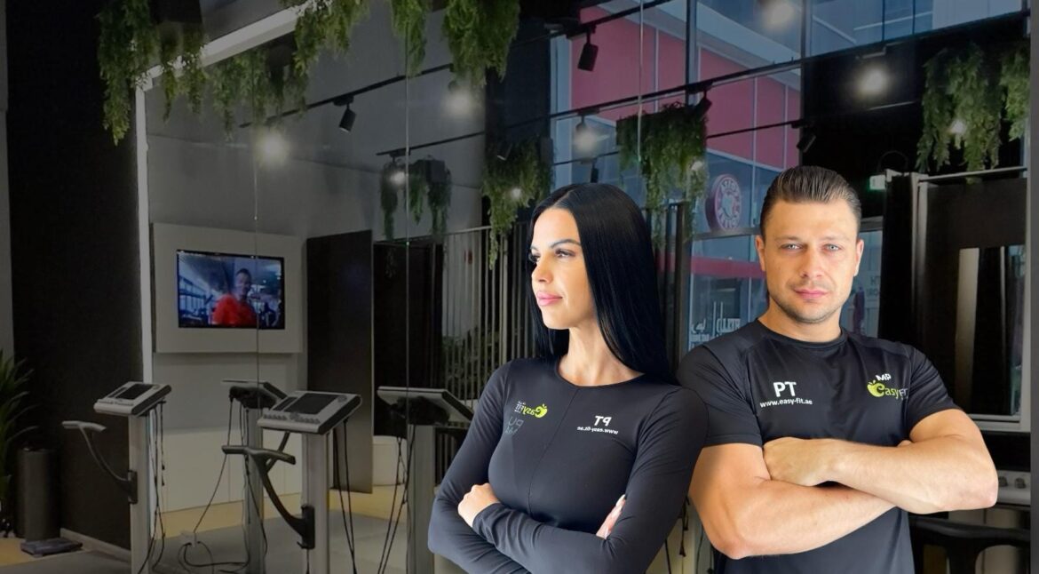 Two Easy Fit personal trainers inside an EMS studio